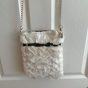 Off white fluffy purse with gold chain strap. Brand new